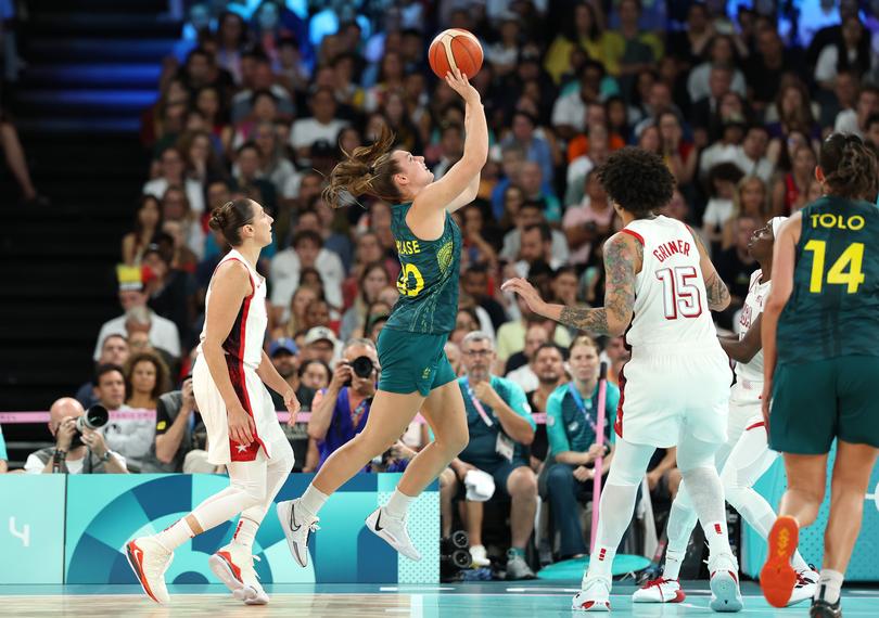 PARIS, FRANCE - AUGUST 09: Isobel Borlase #20 of Team Australia shoots over Diana Taurasi #12 of Team United States during a Women's semifinal match between Team United States and Team Australia on day fourteen of the Olympic Games Paris 2024 at Bercy Arena on August 09, 2024 in Paris, France. (Photo by Gregory Shamus/Getty Images)