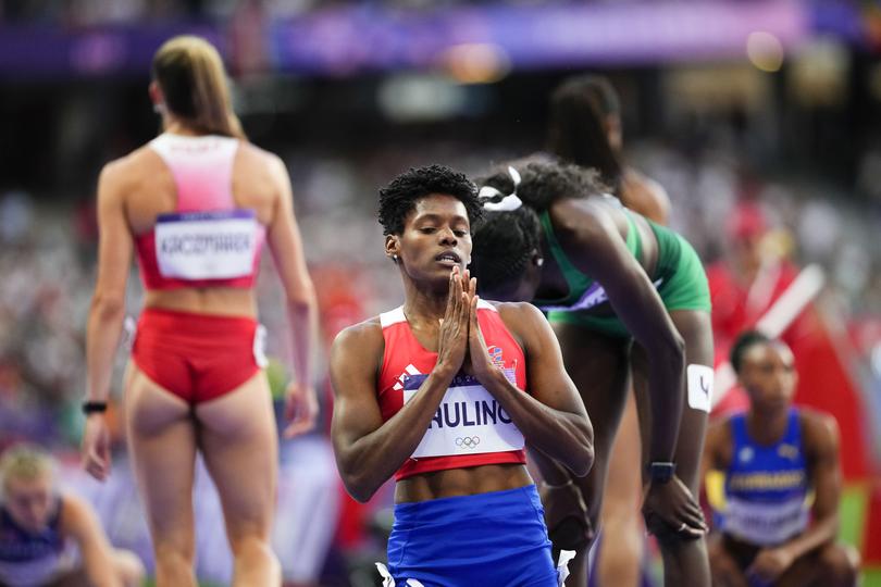 Marileidy Paulino, of the Dominican Republic, celebrates after winning the women's 400-meter final at the 2024 Summer Olympics, Friday, Aug. 9, 2024, in Saint-Denis, France.(AP Photo/Petr David Josek)