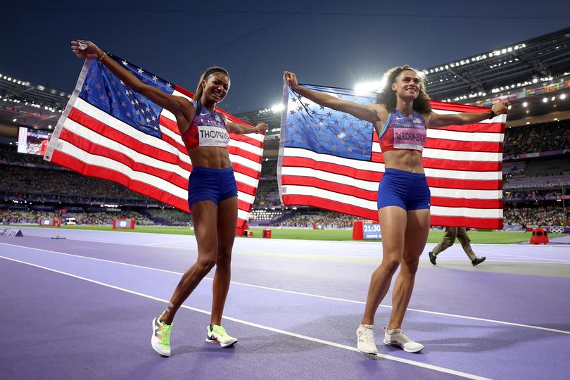 PARIS, FRANCE - AUGUST 10: Sydney McLaughlin-Levrone and Gabrielle Thomas of Team United States celebrate winning the Gold medal in the Women's 4 x 400m Relay Final on day fifteen of the Olympic Games Paris 2024 at Stade de France on August 10, 2024 in Paris, France. (Photo by Christian Petersen/Getty Images)