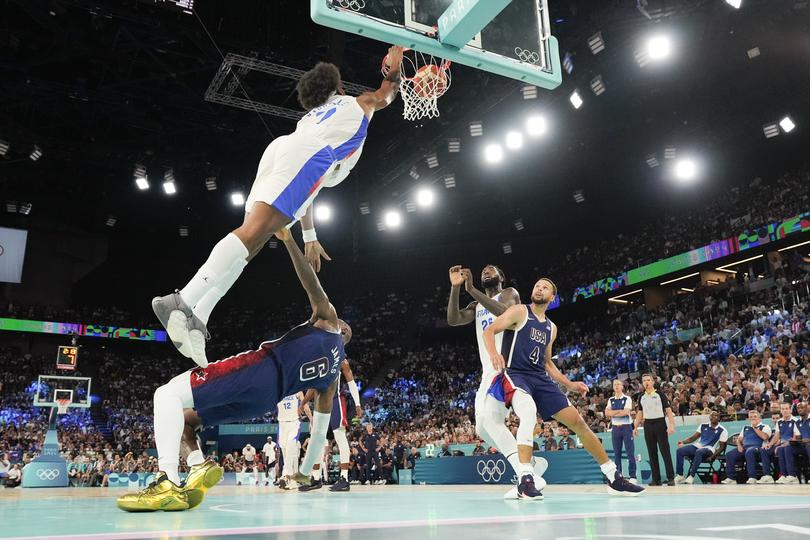Guerschon Yabusele dunks over LeBron James.