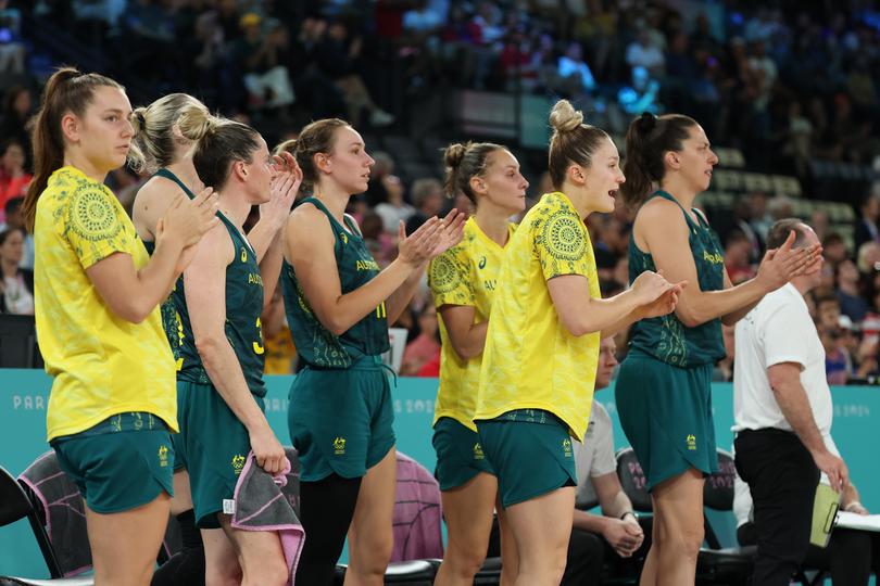 PARIS, FRANCE - AUGUST 09: Team Australia players react during a Women's semifinal match between Team United States and Team Australia on day fourteen of the Olympic Games Paris 2024 at Bercy Arena on August 09, 2024 in Paris, France. (Photo by Gregory Shamus/Getty Images)