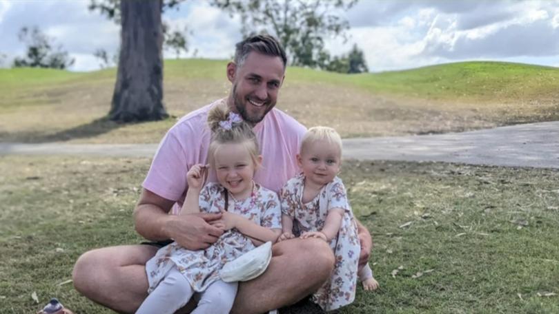 Ken Hemsworth with his two daughters.