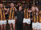 Sam Mitchell and his players sing the team song after demolishing Carlton.