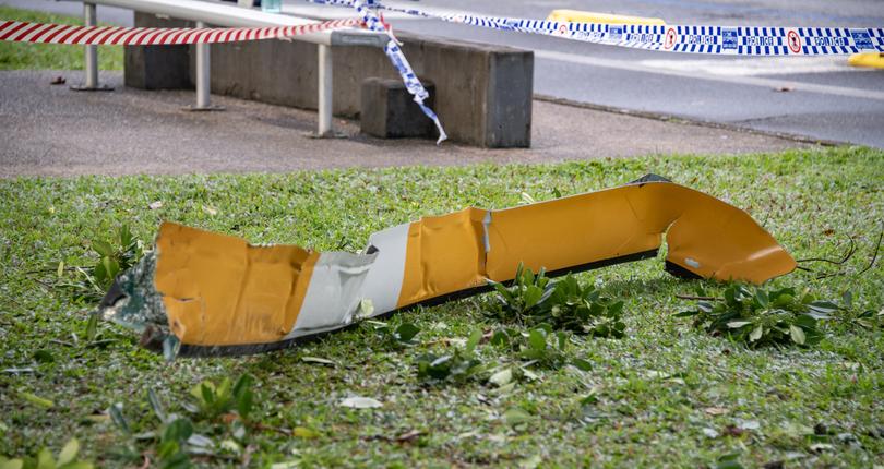 Debris from a helicopter is seen after it crashed into the roof of the Double Tree by Hilton Hotel, in Cairns, Monday, August 12, 2024. Police have declared a Public Safety Preservation Act in Cairns after the chopper crashed into the building shortly before 2am on Monday. (AAP Image/Brian Cassey) NO ARCHIVING