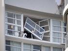 A broken window and damaged rooftop is seen at the Double Tree by Hilton Hotel after a helicopter crashed into its roof, in Cairns, Monday, August 12, 2024. Police have declared a Public Safety Preservation Act in Cairns after the chopper crashed into the building shortly before 2am on Monday. (AAP Image/Brian Cassey) NO ARCHIVING