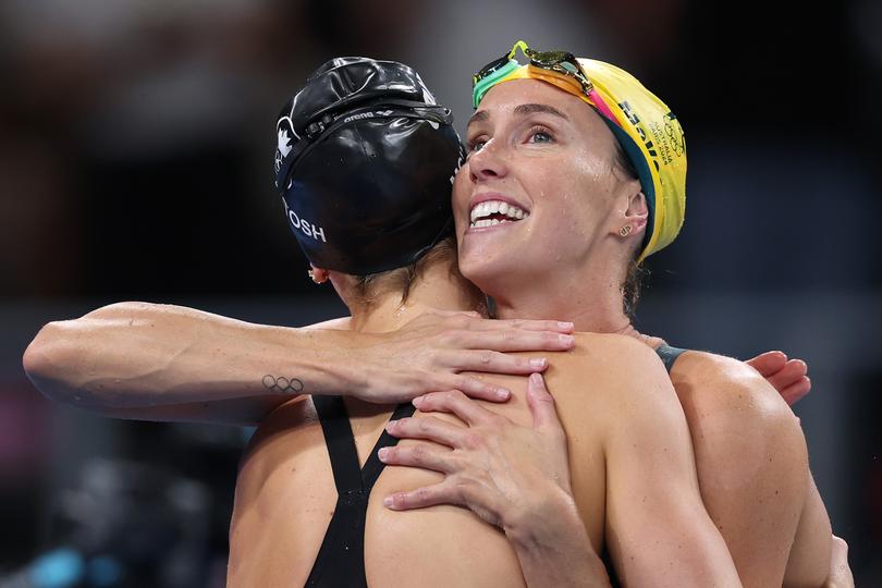 NANTERRE, FRANCE - AUGUST 04: Kaylee McKeown of Team Australia and Summer McIntosh of Team Canada embrace after competing in the Women's 4x100m Medley Relay Final on day nine of the Olympic Games Paris 2024 at Paris La Defense Arena on August 04, 2024 in Nanterre, France. (Photo by Maddie Meyer/Getty Images)