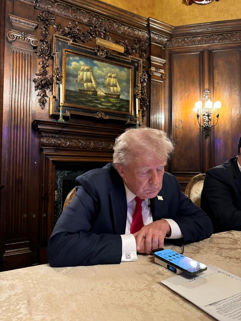 Donald Trump speaks to Elon Musk on the phone during a livestream audio interview on X. 