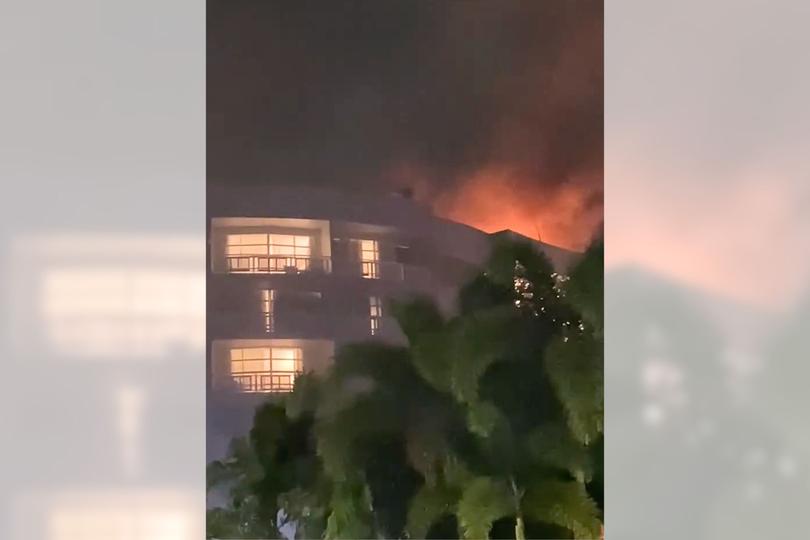 Fire on the roof of the Double Tree by Hilton Hotel after the crash. 