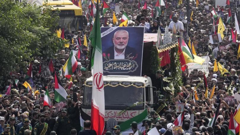 Iranian authorities say they must respond following an attack that killed Ismail Haniyeh in Tehran. (AP PHOTO)