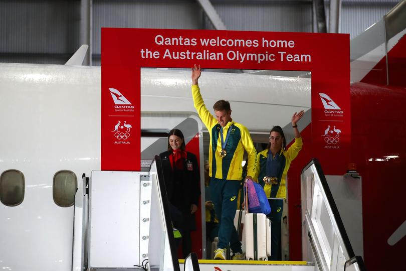 Athletes disembark during the Australian Olympic Games athletes charter flight arrival.