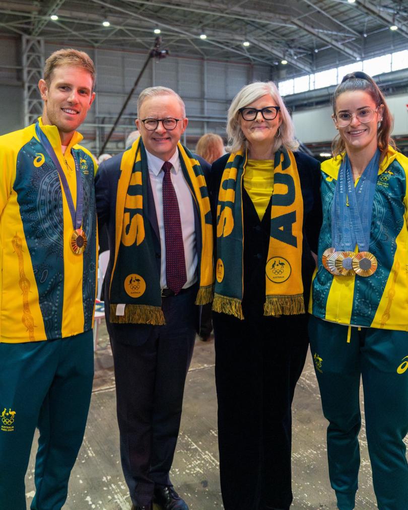 Prime Minister Anthony Albanese greets the Australian olympic athletes as they arrive at Sydney airport.