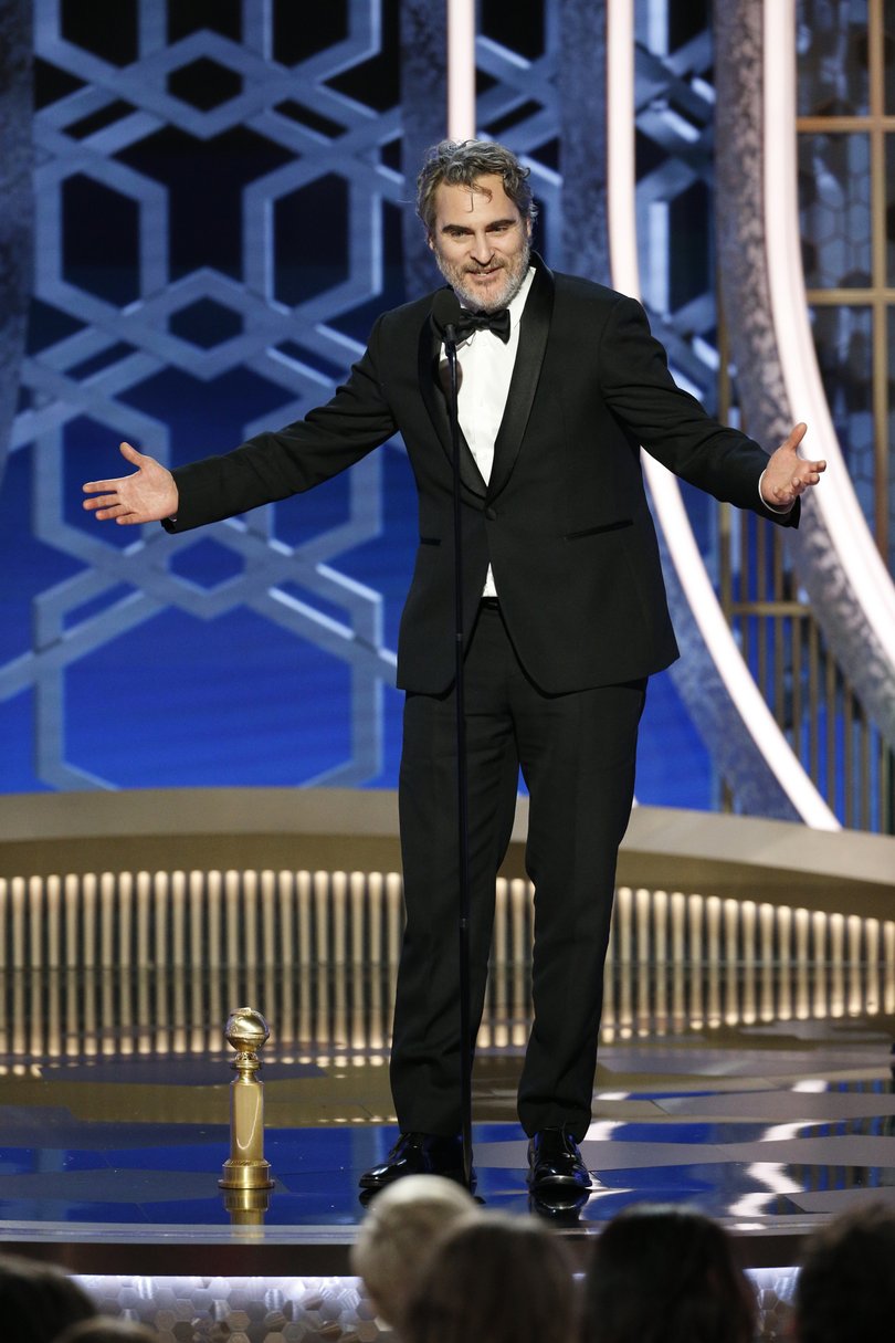 This image released by NBC shows Joaquin Phoenix accepting the award for best actor in a motion picture drama for his role in "Joker" at the 77th Annual Golden Globe Awards at the Beverly Hilton Hotel in Beverly Hills, Calif., on Sunday, Jan. 5, 2020. (Paul Drinkwater/NBC via AP)