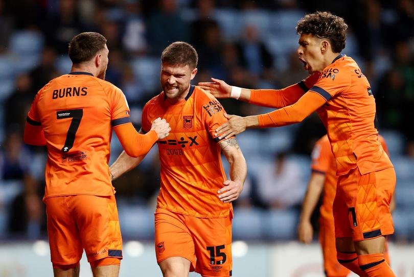 COVENTRY, ENGLAND - APRIL 30: Cameron Burgess of Ipswich Town celebrates with teammates Wes Burns and Jeremy Sarmiento after scoring his team's second goal during the Sky Bet Championship match between Coventry City and Ipswich Town at The Coventry Building Society Arena on April 30, 2024 in Coventry, England. (Photo by Naomi Baker/Getty Images)