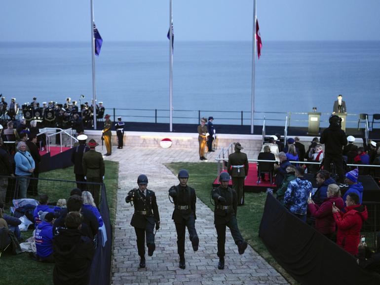 Australian and New Zealand soldiers take part in a dawn service ceremony at the Anzac Cove beach in Turkey.