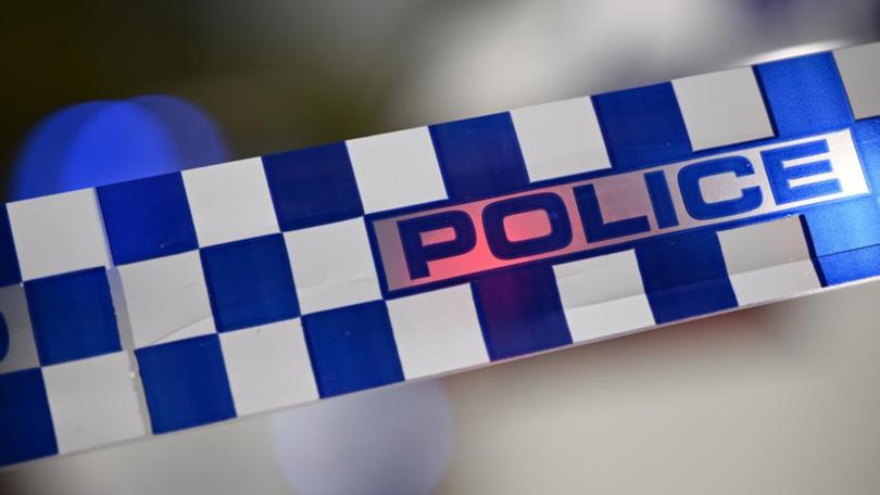 A woman has died in a two-vehicle crash on a Northern Territory highway, with at least nine patients being assessed for injuries.