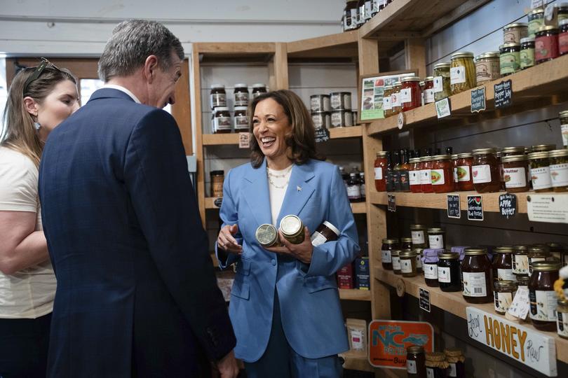 Vice President Kamala Harris talks with North Carolina Governor Roy Cooper.