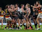 Power's Dan Houston was engulfed in a melee after he knocked out the Crows' Izak Rankine.  (Matt Turner/AAP PHOTOS)