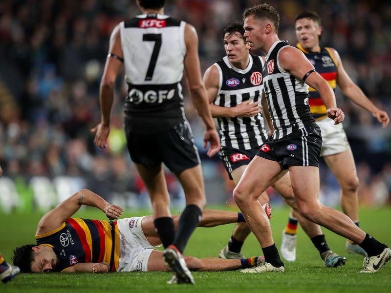 Adelaide's Izak Rankine and Port Adelaide's Dan Houston.