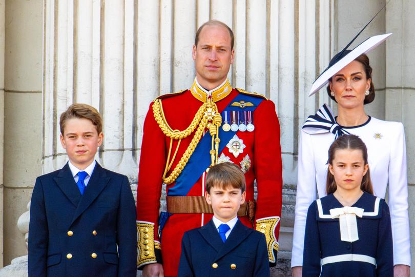 The family shed their usual public formality for a fun family day out. 