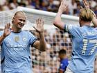 Erling Haaland (l) celebrates after his opener in the 2-0 win over Chelsea.