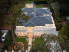 The luxury modern mansion sold for $10.8 million at auction in a weekend when auction numbers were slightly up.