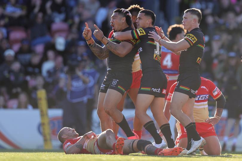 PENRITH, AUSTRALIA - JULY 21: Moses Leota of the Panthers celebrates scoring a try with teammates during the round 20 NRL match between Penrith Panthers and Dolphins at BlueBet Stadium on July 21, 2024 in Penrith, Australia. (Photo by Jason McCawley/Getty Images)