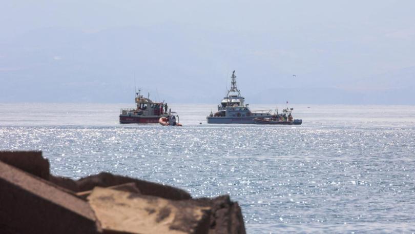 Italian authorities are searching for survivors after a luxury yacht sank off Porticello in Sicily. (EPA PHOTO)