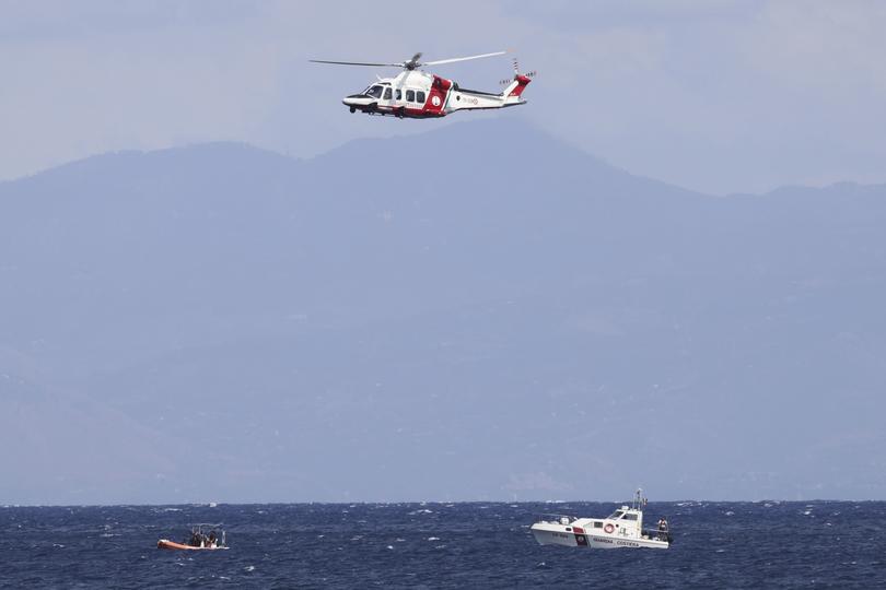 Emergency services at the scene of the search for a missing boat, in Porticello Santa Flavia, Italy, Monday, Aug. 19, 2024. British tech giant Mike Lynch, his lawyer and four other people are among those missing after their luxury superyacht sank during a freak storm off Sicily, Italy’s civil protection and authorities said. Lynch’s wife and 14 other people survived. (Alberto Lo Bianco /LaPresse via AP)