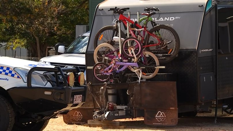 A car towing caravan with a family inside has been stolen from the outback Queensland caravan park.