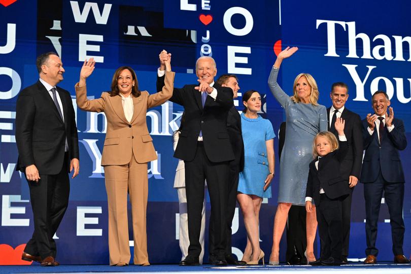 US President Joe Biden hand in hand with US Vice President Kamala Harris after delivering the keynote address, as the Biden family stands alongside them at the Democratic National Convention.