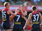  Jack Viney celebrates with teammates after kicking a goal during the round 23 match between Gold Coast Suns and Melbourne.