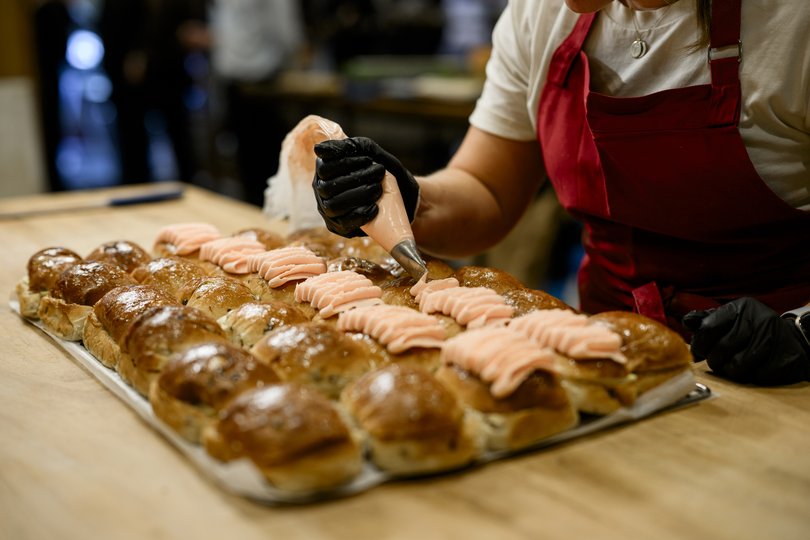 Humble Bakery’s finger buns are made with dried cranberries, golden raisins, currants and pink cream cheese frosting.