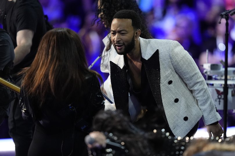 John Legend performs during the Democratic National Convention Wednesday, Aug. 21, 2024, in Chicago. (AP Photo/Charles Rex Arbogast)