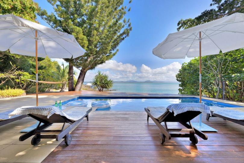 The residence boasts a pool with stunning views of the ocean.