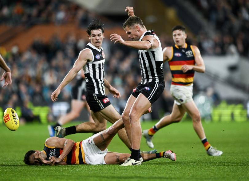 ADELAIDE, AUSTRALIA - AUGUST 17:   Izak Rankine of the Crows is knocked out by  a late hit from  Dan Houston of the Power during the round 23 AFL match between Port Adelaide Power and Adelaide Crows at Adelaide Oval, on August 17, 2024, in Adelaide, Australia. (Photo by Mark Brake/Getty Images)