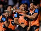 Latu Fainu (c) celebrates with Wests Tigers teammates after scoring in an upset NRL win over Manly. (Dan Himbrechts/AAP PHOTOS)