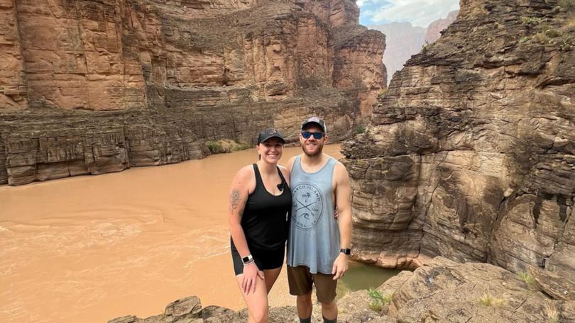 Chenoa Nickerson, who went missing at Grand Canyon National Park after she was swept into a creek during a flash flood, pictured hiking with her husband earlier.