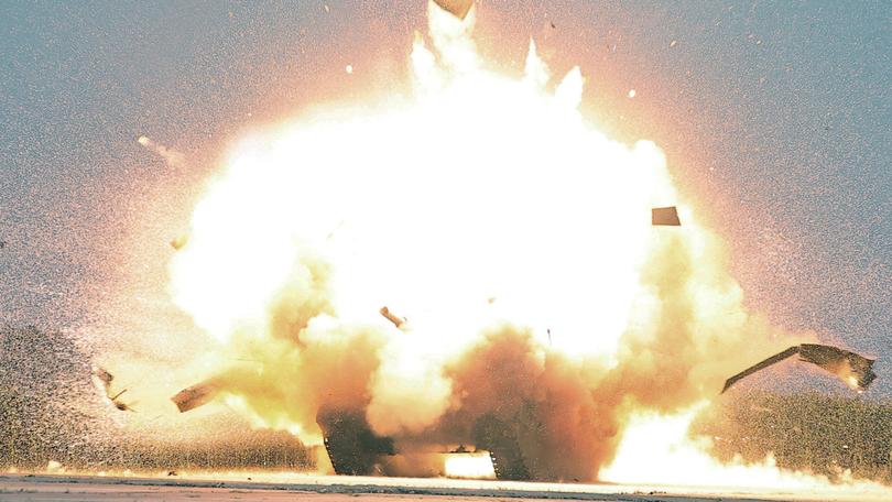 A photo released by the official North Korean Central News Agency shows an explosion of a target during a performance test.