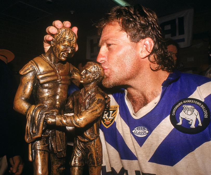 Terry Lamb kisses the Winfield Cup after winning the ARL Grand Final in 1995.