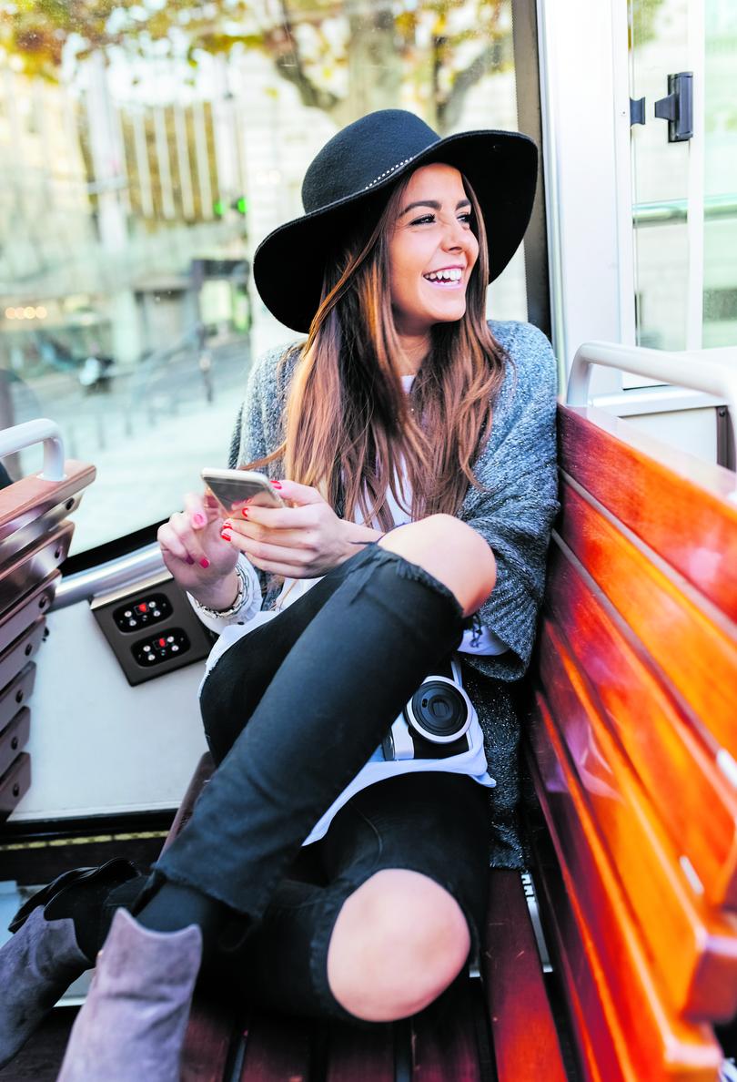 Paris, France, smiling woman on a tourist bus