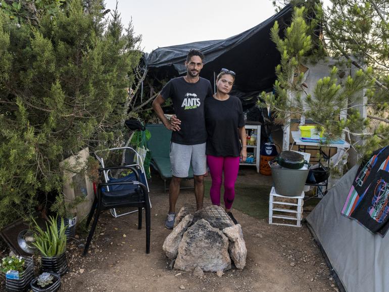 Jonathan Sanchez and Sandra Velazquez live in a tent at the Can Rova camp in Ibiza, Spain.