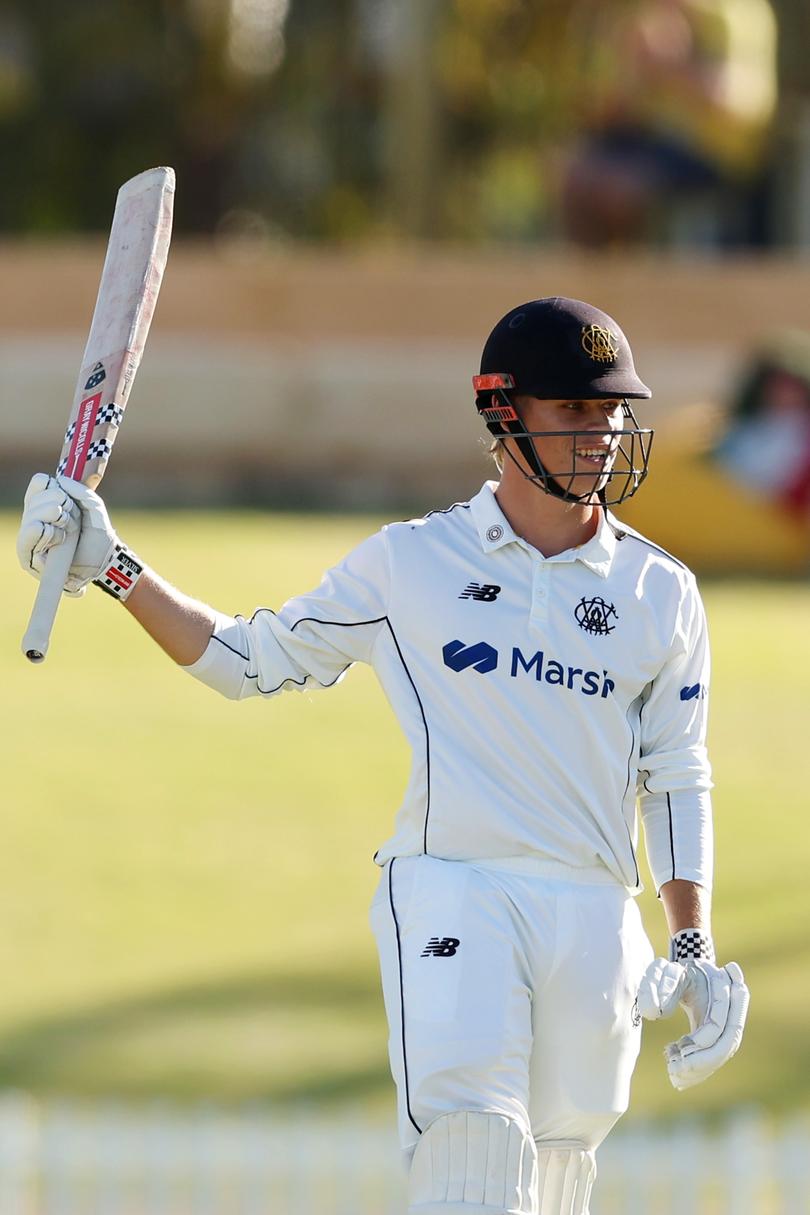 Cooper Connolly of Western Australia raises his bat after reaching 50 during day one of the Sheffield Shield Final.