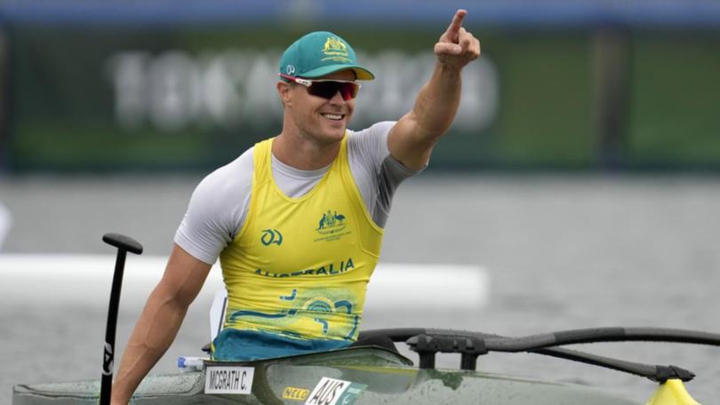 Curtis McGrath celebrates his gold medal win in canoe sprint men's Va'a single 200m in Tokyo. (AP PHOTO)