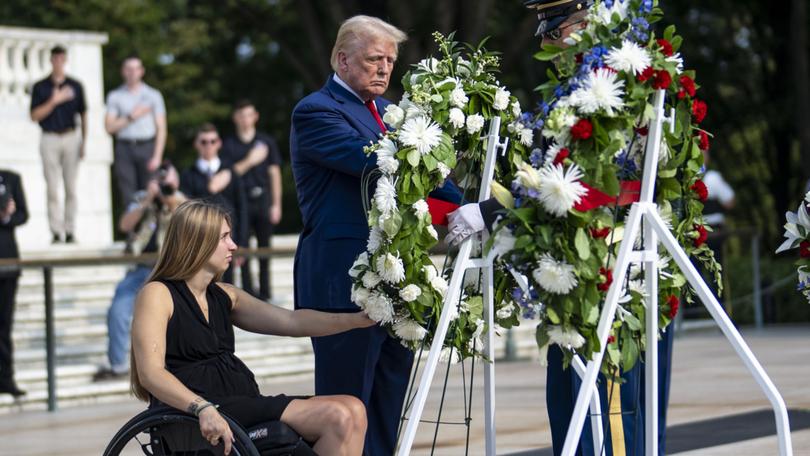 Former President Donald Trump attends a wreath-laying ceremony at Arlington National Cemetery.