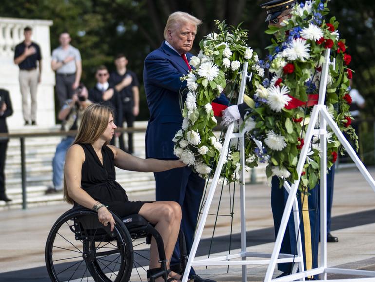 Former President Donald Trump attends a wreath-laying ceremony at Arlington National Cemetery.