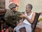 Qaid Farhan Alkadi talks to the commanding officer of the 162nd Division, Brig. Gen. Itzik Cohen, after his rescue. 