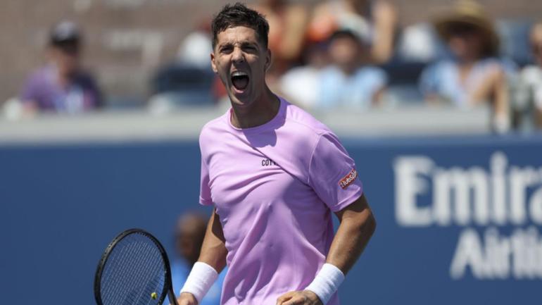 Thanasi Kokkinakis celebrates winning a key point in his win over Stefanos Tsitsipas.