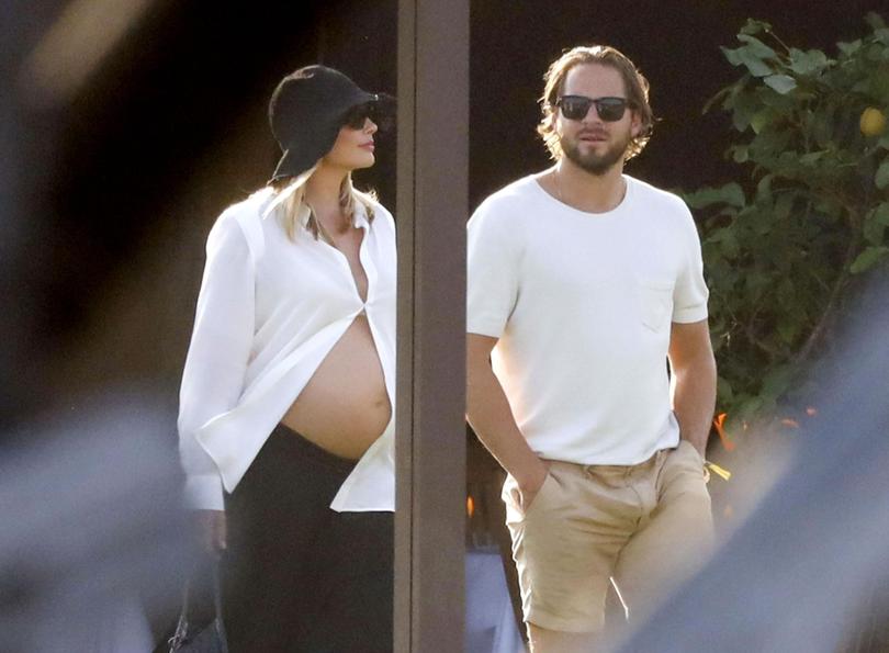 Pregnant Margot was all smiles as she was seen enjoying lunch with her beau and some friends during their getaway in Sardinia.
