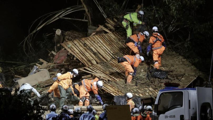 Authorities say one person died in the city of Gamagori after a landslide buried a house. (EPA PHOTO)