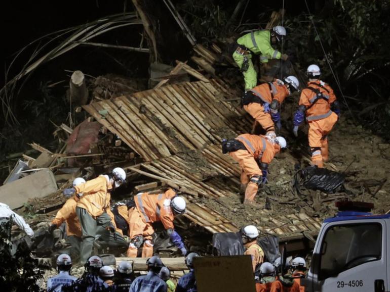 Authorities say one person died in the city of Gamagori after a landslide buried a house. (EPA PHOTO)